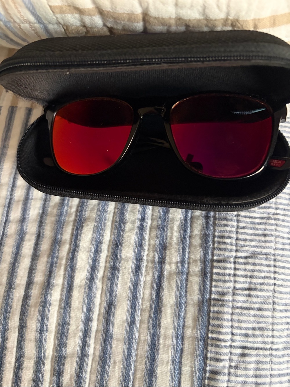 Oakley Black Frame Sunglasses with Red Reflective Lenses style 0009340
